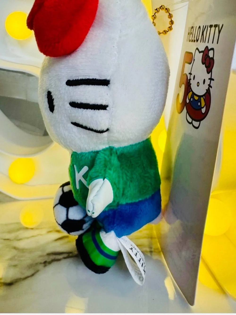 Sanrio Hello Kitty Plush in White, Red Bow & Green Jersey with Soccer Ball